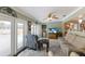 Relaxing living room featuring french doors to the pool, comfortable seating and lots of natural light at 715 Fontana Ln, Bradenton, FL 34209