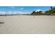Beautiful beach view with volleyball nets and picnic tables at 715 Fontana Ln, Bradenton, FL 34209