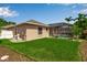 Backyard exterior featuring a pool cage and well-maintained lawn at 730 Old Quarry Rd, Bradenton, FL 34212