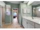 Bathroom featuring a tiled floor, a walk-in shower, and a double sink vanity at 730 Old Quarry Rd, Bradenton, FL 34212