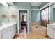 Primary bathroom with a soaking tub, separate vanities and private toilet room at 730 Old Quarry Rd, Bradenton, FL 34212