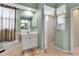 Bathroom with a soaking tub, tiled floors, and a walk-in shower at 730 Old Quarry Rd, Bradenton, FL 34212