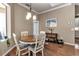 Dining area with wood floors, traditional decor and room for four to enjoy meals at 730 Old Quarry Rd, Bradenton, FL 34212