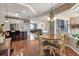 Cozy dining area next to the kitchen with wood floors and views into the living spaces at 730 Old Quarry Rd, Bradenton, FL 34212