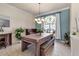 Well-lit dining area featuring tiled floors, a modern table, and a large window at 730 Old Quarry Rd, Bradenton, FL 34212