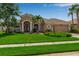 Attractive single-Gathering home with a manicured lawn, mature landscaping, and neutral color scheme at 730 Old Quarry Rd, Bradenton, FL 34212