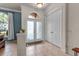 Bright entryway featuring tile flooring, a decorative front door, and a neutral color palette at 730 Old Quarry Rd, Bradenton, FL 34212