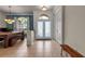 Open foyer with tile flooring, decorative glass front doors, and easy access to the adjacent dining room at 730 Old Quarry Rd, Bradenton, FL 34212