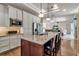 Spacious kitchen with island seating, stainless steel appliances, and open view to the living area at 730 Old Quarry Rd, Bradenton, FL 34212