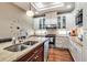 Well-lit kitchen featuring a large island with a sink, stainless steel appliances, and ample counter space at 730 Old Quarry Rd, Bradenton, FL 34212
