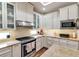 Bright, updated kitchen features stainless appliances, granite countertops, and ample cabinet space at 730 Old Quarry Rd, Bradenton, FL 34212