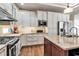 Stylish kitchen featuring granite countertops, stainless steel appliances, and white cabinetry at 730 Old Quarry Rd, Bradenton, FL 34212