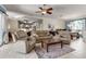 Open living space featuring tile floors, plush seating, and seamless access to the kitchen at 730 Old Quarry Rd, Bradenton, FL 34212