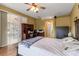 Large primary bedroom features wood floors, desk and backyard access through sliding glass door at 730 Old Quarry Rd, Bradenton, FL 34212
