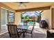 Outdoor patio featuring a table and chairs, ceiling fan, and a black grill at 730 Old Quarry Rd, Bradenton, FL 34212