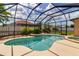Screened pool and spa area with lush landscaping around the black frame at 730 Old Quarry Rd, Bradenton, FL 34212