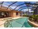Screened pool and spa area with a view of the patio and the house at 730 Old Quarry Rd, Bradenton, FL 34212