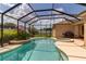 Relaxing screened-in pool area featuring a spa, lush plants, and views of the backyard at 730 Old Quarry Rd, Bradenton, FL 34212