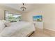 Bedroom featuring a sliding glass door, wood floors, and a view of the lanai at 7327 38Th Court East, Sarasota, FL 34243