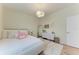 Bedroom features a plush bed, hardwood floors, bright light, and soft textures at 7327 38Th Court East, Sarasota, FL 34243