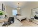 Cozy bedroom with a desk, stylish decor, and a large mirror at 7327 38Th Court East, Sarasota, FL 34243