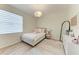 Cozy bedroom features a plush bed, soft textures, and stylish decor for a relaxing retreat at 7327 38Th Court East, Sarasota, FL 34243