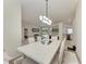 Open-concept dining area with views into the kitchen, living room, and access to an outdoor space at 7327 38Th Court East, Sarasota, FL 34243