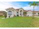 Charming single-story home with a well-manicured lawn and a beautiful red tile roof at 7327 38Th Court East, Sarasota, FL 34243