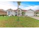 Charming single-story home with a well-manicured lawn and a beautiful red tile roof at 7327 38Th Court East, Sarasota, FL 34243