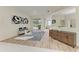Open foyer showcases stylish decor, a sliding glass door to the patio, and wood-look flooring at 7327 38Th Court East, Sarasota, FL 34243