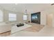 Modern living room with a decorative fireplace, sleek furnishings, and stylish lighting at 7327 38Th Court East, Sarasota, FL 34243