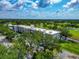 Beautiful aerial view of the condo complex, showing golf course and trees at 7461 W Country Club N Dr # 203, Sarasota, FL 34243