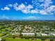 High-angle view of a well-maintained residential area featuring a golf course and waterways at 7461 W Country Club N Dr # 203, Sarasota, FL 34243