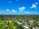 Breathtaking aerial of a golf course community, complete with lush landscaping and winding waterways at 7461 W Country Club N Dr # 203, Sarasota, FL 34243