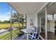 Relax on this private balcony with golf course views and enjoy the outdoor seating area at 7461 W Country Club N Dr # 203, Sarasota, FL 34243