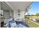 Enjoy beautiful views of the pond and golf course from this condo's screened-in balcony at 7461 W Country Club N Dr # 203, Sarasota, FL 34243
