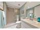 Bathroom features a walk-in shower, a clean white sink, and a well-lit mirror at 7461 W Country Club N Dr # 203, Sarasota, FL 34243