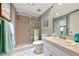 Bathroom features a walk-in shower, a clean white sink, and a well-lit mirror at 7461 W Country Club N Dr # 203, Sarasota, FL 34243