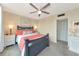 Cozy bedroom offers a comfortable sleeping space with a ceiling fan and neutral decor at 7461 W Country Club N Dr # 203, Sarasota, FL 34243