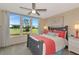 This bedroom features golf course views and a ceiling fan, offering a serene and relaxing retreat at 7461 W Country Club N Dr # 203, Sarasota, FL 34243