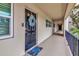 Exterior walkway featuring neutral paint, a wreath and welcome mat at unit 203 at 7461 W Country Club N Dr # 203, Sarasota, FL 34243