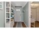 Stylish entryway with decorative shelving and ocean-themed decor, creating an inviting welcome at 7461 W Country Club N Dr # 203, Sarasota, FL 34243