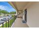 Exterior of the home featuring a sidewalk and well maintained green space and landscaping at 7461 W Country Club N Dr # 203, Sarasota, FL 34243