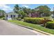 Elegant community sign amidst lush landscaping, creating an inviting entrance to Village des Pins Pinetree at 7926 Woodpointe Ct # 29, Sarasota, FL 34238
