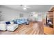 Open-concept living room with dining area, plenty of natural light, and modern flooring at 7926 Woodpointe Ct # 29, Sarasota, FL 34238