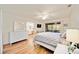 Bright main bedroom with a white dresser and access to the screened-in patio at 7926 Woodpointe Ct # 29, Sarasota, FL 34238