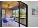 Screened-in patio with table and chairs, offering serene water views and a relaxed atmosphere at 7926 Woodpointe Ct # 29, Sarasota, FL 34238