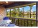 Covered patio with seating area offering scenic views of the lake at 7926 Woodpointe Ct # 29, Sarasota, FL 34238