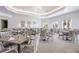 An elegant dining room with beautifully set tables, comfortable seating, and a bright, inviting ambiance at 8218 Genoa Blvd, Lakewood Ranch, FL 34202
