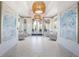 A bright lobby featuring modern light fixtures, artwork, comfortable seating, and elegant decor at 8218 Genoa Blvd, Lakewood Ranch, FL 34202